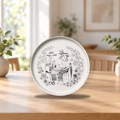 Emilia Plate 24cm by Raija Uosikkinen – product photo on a table