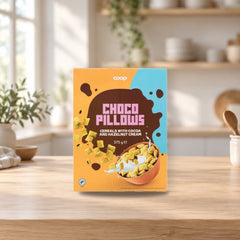 Coop Cocoa Pillows Oat-Wheat Cereal 375g – product photo on a table