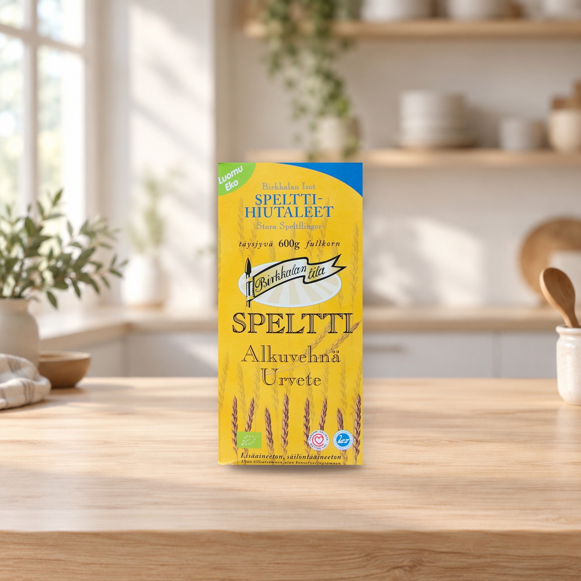 Organic Large Spelt Flakes 600g – product photo on a table