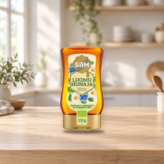 Hunajainen SAM Organic Honey 250g – product photo on a table