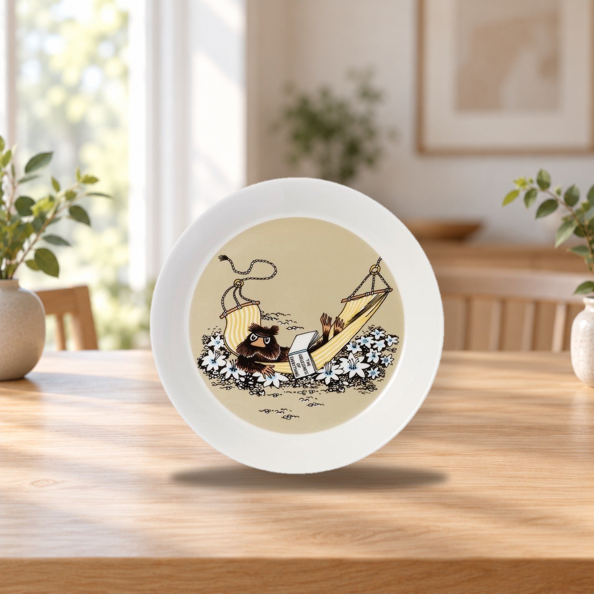 Moomin Plate 19cm Rat King in Cave – product photo on a table