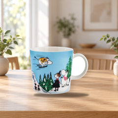 Moomin Arabia Mug 0.3L Ski Jumping Winter 2024 – product photo on a table