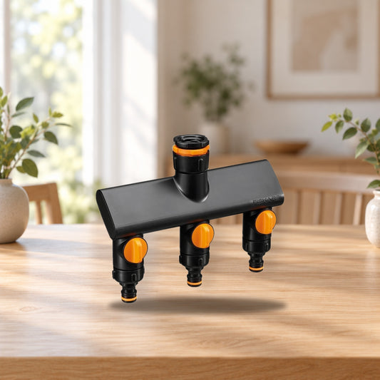 Fiskars Comfort Faucet Connector with 3 On/Off Valves – product photo on a table