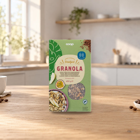 Coop Granola Cocoa, Apple & Passion Fruit 450g – product photo on a table