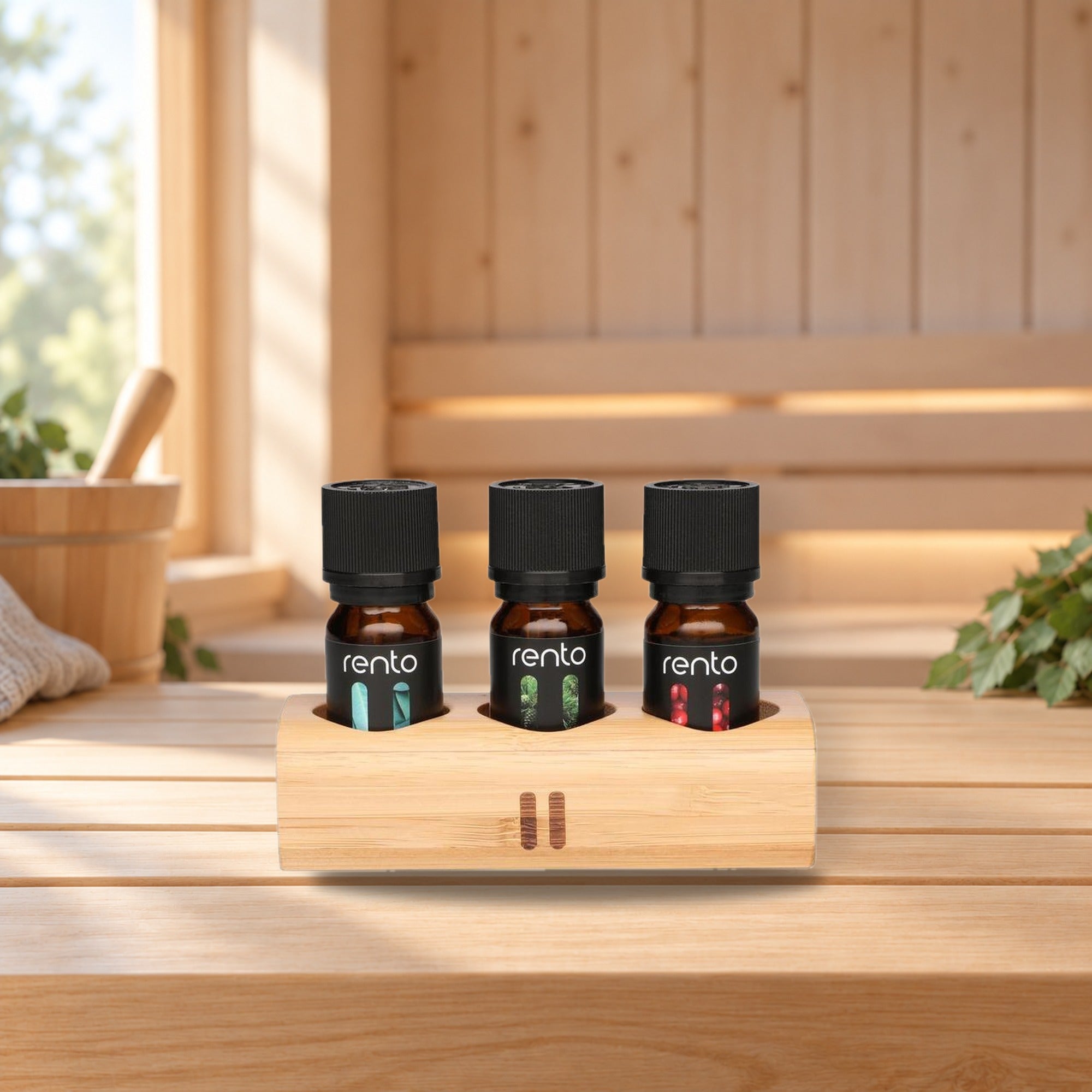 Rento Sauna Fragrances 3 x 10 ml with Bamboo Stand – product photo on a table