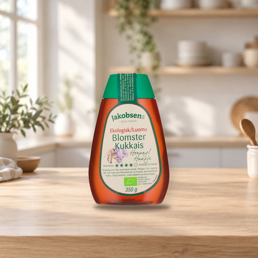 Jakobsens Organic Honey 350g – product photo on a table