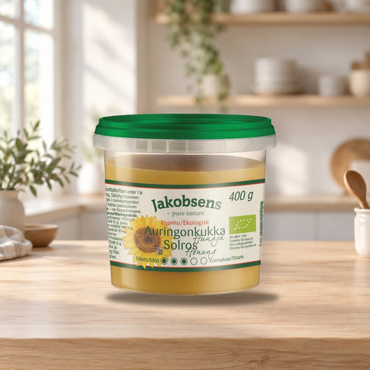 Jakobsens Organic Sunflower Honey 400g – product photo on a table
