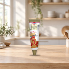 Dr. Oetker Red Icing 125g for Christmas Cookies – product photo on a table